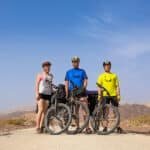 Happy,Friends,With,Bicycles,On,Road,In,Desert.,Israel